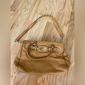 Michael Kors brown leather handbag satchel with a strap